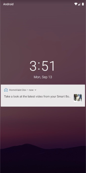 Phone lock screen with a push notification for a new smart box video